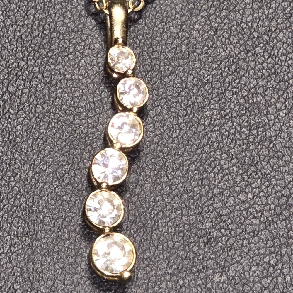 Gold Tone Necklace with Squiggly Rhinestones Pendant